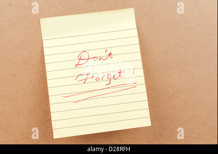 Don't forget words written on a sticky note Stock Photo