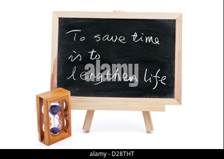 "To save time is to lengthen life" saying written on blackboard Stock Photo