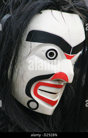 Arrival Of Canoes At Tribal Journeys Cowichan Bay, Masked Paddler (Puller), B.C., Canada Stock Photo