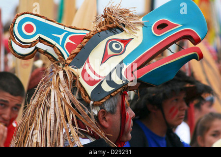 Arrival Of Canoes At Tribal Journeys Cowichan Bay, Man Wearing Headress, B.C., Canada Stock Photo