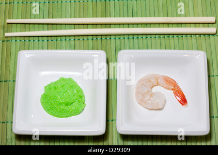 Sushi shrimp and wasabi on bamboo mat Stock Photo