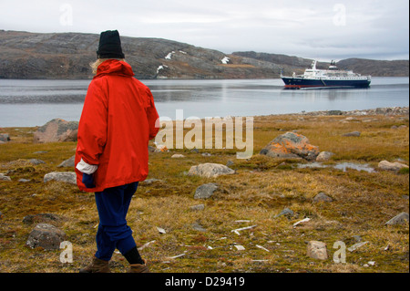 Cruise North Expedition Shore Excursion Passenger With Lyubov Orlova In Background, Northwest Passage, Nunavut Stock Photo