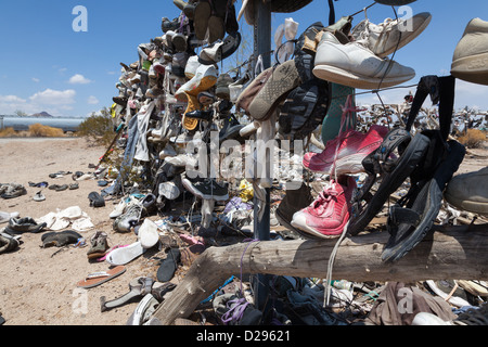 A shoe fence on CA 62 near Rice, west of Vidal Junction, California USA Stock Photo