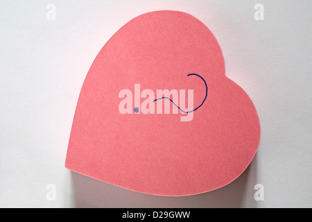 ? message written on pink heart shaped sticky note pad isolated on white background Stock Photo