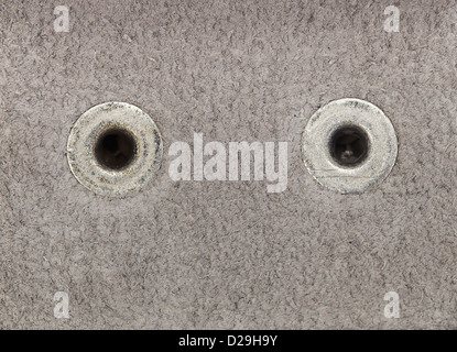 Close up photo of white leather with two rivets in high resolution. Stock Photo
