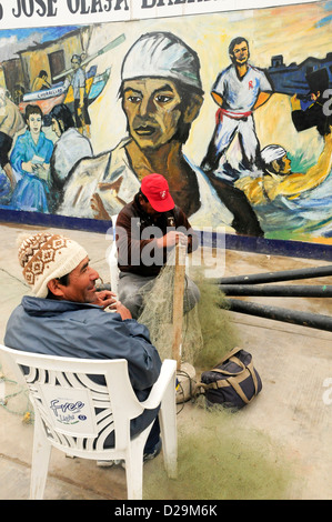 Fisherment Mending Net, Lima, Peru Stock Photo