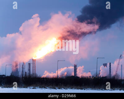 A massive flare is seen from the Olefins 6 'Cracker' plant owned by SABIC at Wilton Site at Redcar, Teesside, UK. This is a necessary safety measure during shut down. The flares have happened several times recently in cold weather conditions leading to complaints from nearby residents in Lazenby and Kirkleatham. Flaring operations started today 17th January 2013. Stock Photo