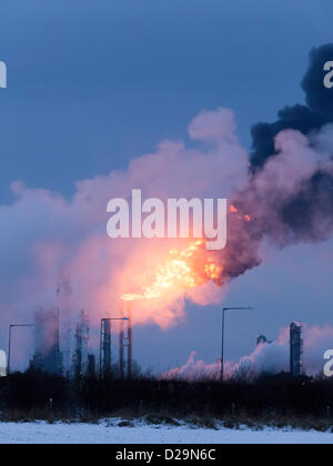 A massive flare is seen from the Olefins 6 'Cracker' plant owned by SABIC at Wilton Site at Redcar, Teesside, UK. This is a necessary safety measure during shut down. The flares have happened several times recently in cold weather conditions leading to complaints from nearby residents in Lazenby and Kirkleatham. Flaring operations started today 17th January 2013. Stock Photo