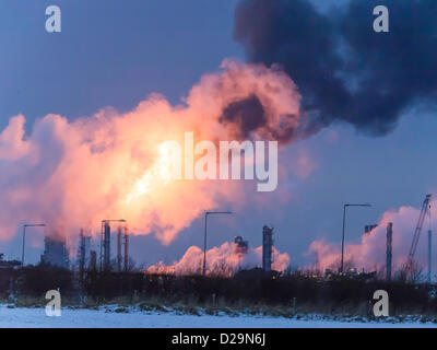 A massive flare is seen from the Olefins 6 'Cracker' plant owned by SABIC at Wilton Site at Redcar, Teesside, UK. This is a necessary safety measure during shut down. The flares have happened several times recently in cold weather conditions leading to complaints from nearby residents in Lazenby and Kirkleatham. Flaring operations started today 17th January 2013. Stock Photo