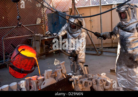 Jan. 17, 2013 - Burbank, California, US -  Workers pour molten bronze into molds during the casting of the Screen Actors Guild statuette, 'The Actor,' at the American Fine Arts Foundry. The stauettes will be handed out to the winners at the 19th Annual SAG Awards on January 27 at the Shrine Auditorium in Los Angeles.(Credit Image: © Brian Cahn/ZUMAPRESS.com) Stock Photo