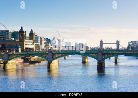 Southwark Bridge over the River Thames, London, England, UK - with Tower Bridge in the background Stock Photo