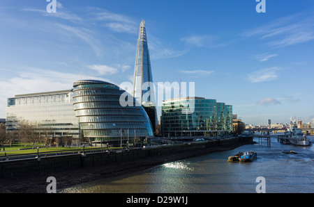 London City Hall and The Shard on the banks of the River Thames, London, UK - seen from Tower Bridge Stock Photo