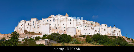 The medieval white fortified hill town walls of Ostuni, The White Town, Puglia, Italy. Stock Photo