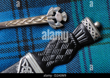 Ancient Hunting Kerr tartan with kilt pin and skean dhu Stock Photo