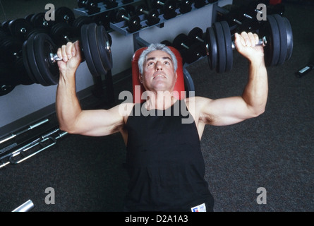 Senior man lifting weights,laughing having fun,  studly, MR282 Stock Photo