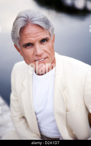 Portrait of middle aged man at home, in business suit Stock Photo