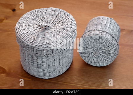 Two white seagrass basket on a wooden table. Stock Photo