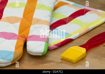 Silicone pastry brush and kitchen glove. Stock Photo