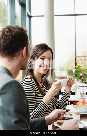 Couple having breakfast together†in cafe Stock Photo