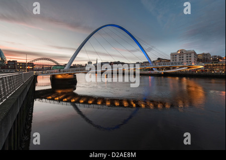 Tyneside at dusk,  evening view from Gateshead riverside of river Tyne and Millennium Bridge leading to the Malmason on Newcastle Quayside