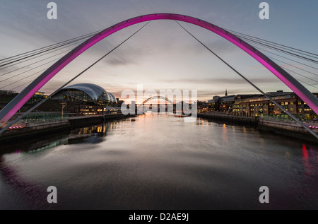 Tyneside at dusk,  view of river Tyne, Sage Gateshead  and Tyne Bridge from the Millennium Bridge between Newcastle and Gateshead Stock Photo