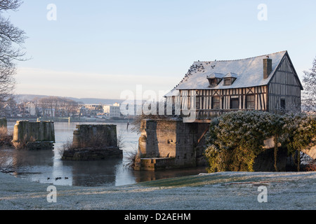 The Old Mill at Vernon, Eure, France, with a covering of frost. Stock Photo