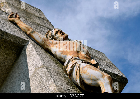 Closeup of Jesus on the stone cross of Salette calvary at Lautrec in southern France. Midi-Pyrénées region, Tarn department Stock Photo