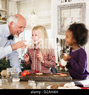 Family baking Christmas cookies together Stock Photo