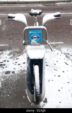 London, UK. 18/01/13. A Barclays Bike or Boris Bike covered in snow, as snow falls in Central London. Stock Photo