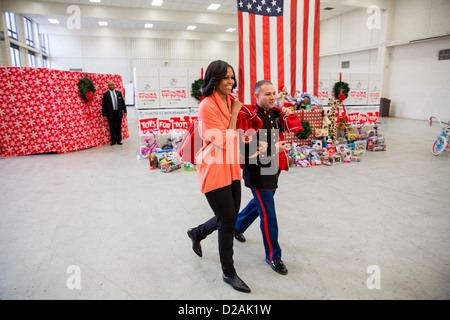 US First Lady Michelle Obama visits the Joint Base Anacostia-Bolling Toys for Tots Distribution Center December 11, 2012 in Washington, DC. Stock Photo