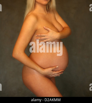 The pregnant woman on the ninth month. The child will be born one of these days Stock Photo