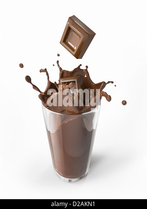 Chocolate blocks falling into a glass full of liquid chocolate, splashing. On white background. Stock Photo
