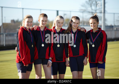 Sports team wearing medals Stock Photo