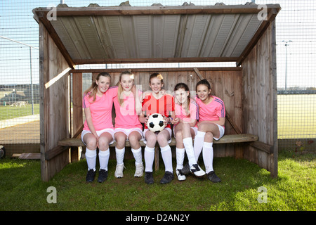 Football team sitting together Stock Photo