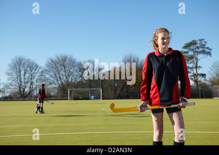 Lacrosse player standing in field Stock Photo