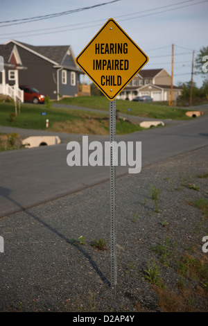 Road sign warning of a hearing impaired child in the street, Halifax, Nova Scotia Stock Photo