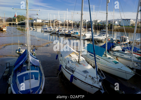 Boats and yachts are all moored up close in the winter period in Portmadog harbour awaiting the spring sailing season. Stock Photo