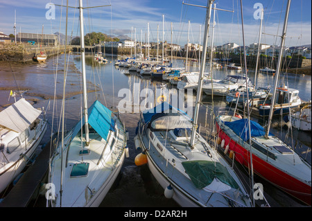 Boats and yachts are all moored up close in the winter period in Portmadog harbour awaiting the spring sailing season. Stock Photo