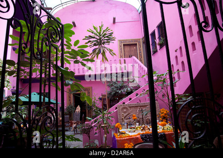 Hotel Meson Sacristia De La Compania Courtyard in town of Puebla filled with goods and antiques that public can buy - Mexico Stock Photo