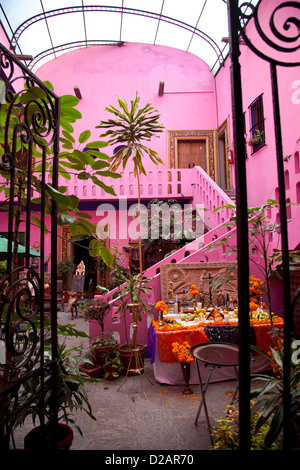 Hotel Meson Sacristia De La Compania Courtyard in town of Puebla filled with goods and antiques that public can buy - Mexico Stock Photo