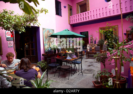 Hotel Meson Sacristia De La Compania Courtyard in town of Puebla filled with goods and antiques that public can buy - Mexico Stock Photo