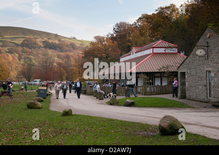 People of all ages (visitors) enjoying day out by scenic countryside cafe (Cavendish Pavilion) - Bolton Abbey Estate, Yorkshire Dales, England, UK. Stock Photo