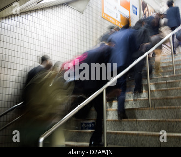 People in motion during rush hour in the Tokyo Metro. Stock Photo