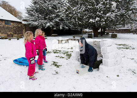 Artist and swimming teacher James Mulhall, 40, builds his first ever igloo in front of Winchester Cathedral. WINCHESTER, UK, 18th Jan, 2013. Stock Photo