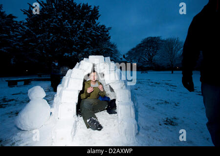 Artist and swimming teacher James Mulhall, 40, builds his first ever igloo in front of Winchester Cathedral. WINCHESTER, UK, 18th Jan, 2013. Stock Photo