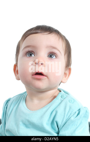 Baby watching attentive with a big blue eyes in a white isolated background Stock Photo