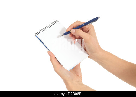 Woman hands writing on a notebook in a white isolated background Stock Photo