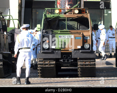 The VHM-1, a French military vehicle, is part of a military parade on the Champs Elysees in Paris, France. It is equipped with heavy infantry equipment, including a missile launcher and turret, and is displayed in its khaki camouflage. Stock Photo