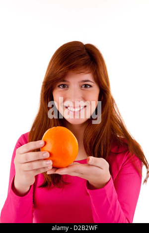 Young woman with orange in hand Stock Photo