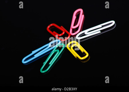 photo of colorfull paper clips on a black background Stock Photo